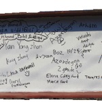 The front of the beam, with many signatures already on it.
