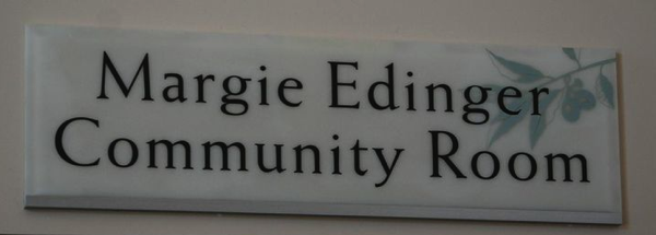 Sign hanging above the Margie Edinger Community Room